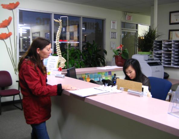 Front desk with a patient checking in