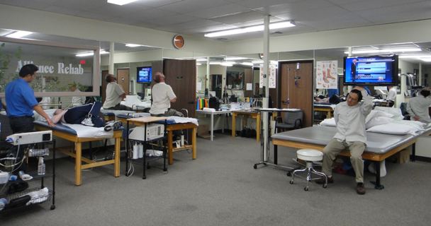 Open treatment floor with treatment tables and exercise equipment